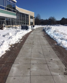 Clear sidewalk after snowfall