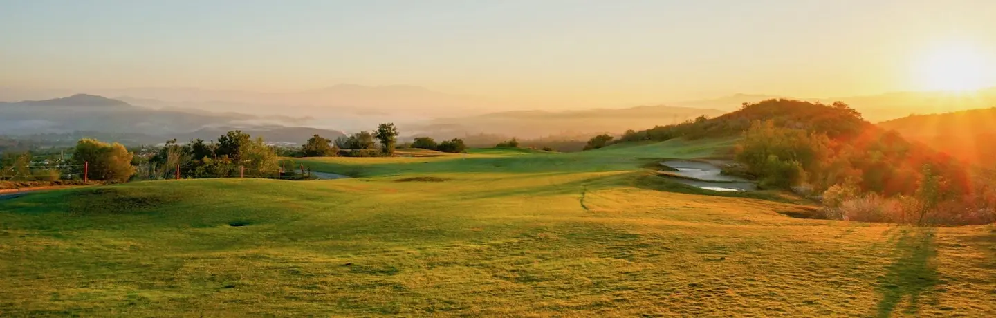 sun rising over golf course