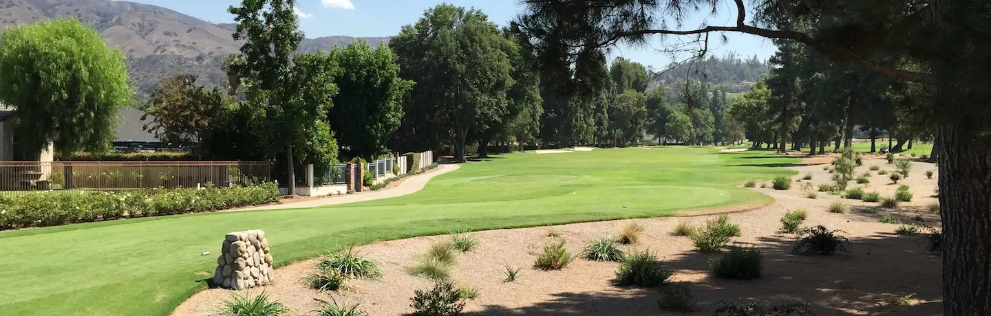golf course greens bordered by low-water use plants