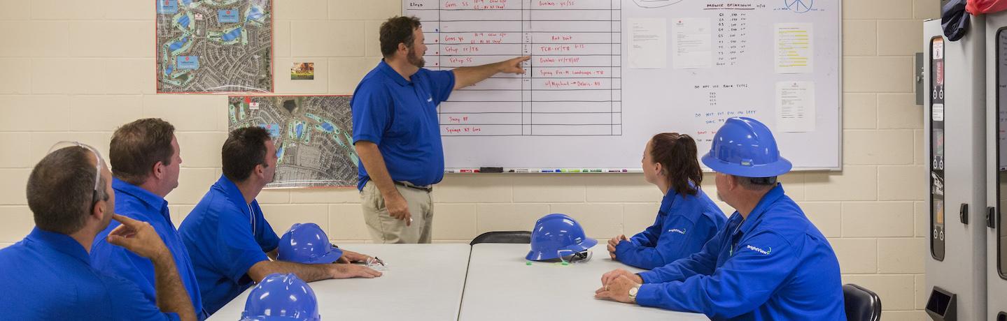 golf course crew members in a staff meeting