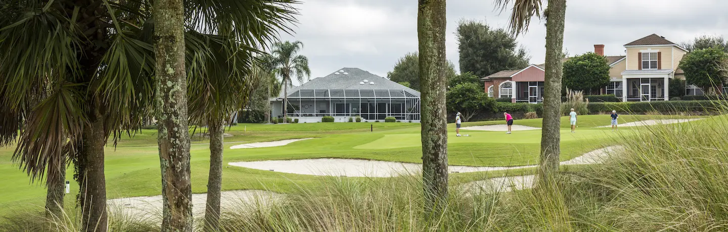 three golfers on the golf course