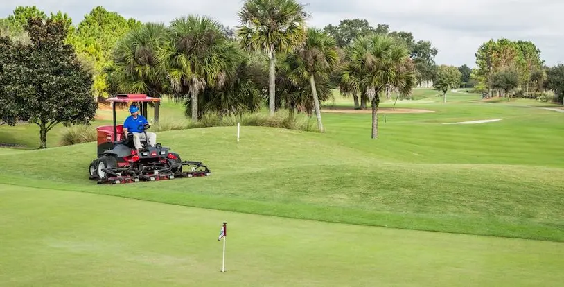 mower on golf course
