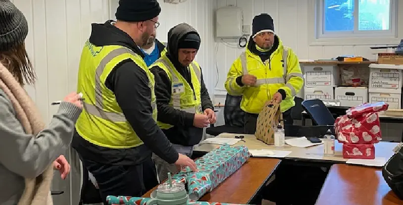 BrightView team members wrapping presents donations